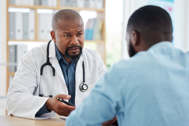 Purchased - Medical doctor talking to a patient about health