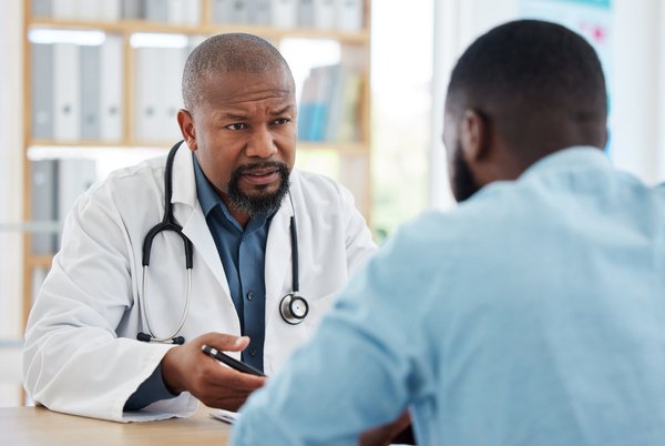Purchased - Medical doctor talking to a patient about health