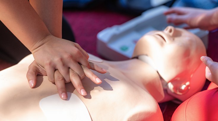 Purchased - Cardiopulmonary Resuscitation, First Aid Training on a CPR Dummy. stock photo