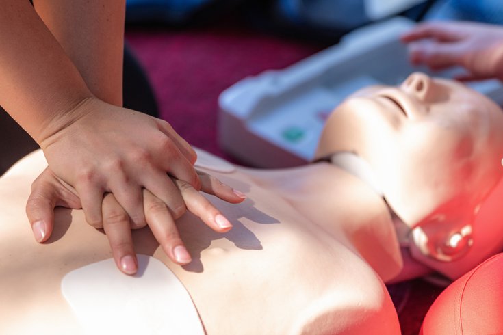 Purchased - Cardiopulmonary Resuscitation, First Aid Training on a CPR Dummy. stock photo