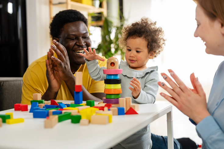 Purchased - Parents playing with their daughter