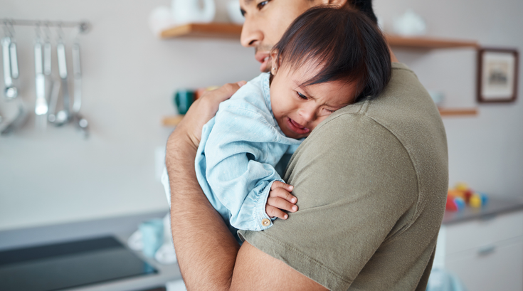 Purchased - Father holding a baby