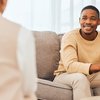 Purchased - Man talking with a therapist smiling