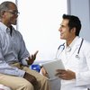 Doctor With Male Patient discussing Prostate Cancer
