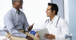 Doctor With Male Patient discussing Prostate Cancer