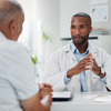 Purchased - Doctor having a serious conversation with a patient