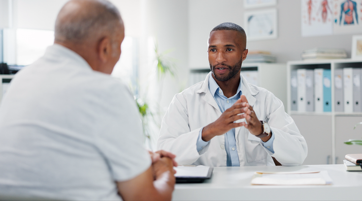 Purchased - Doctor having a serious conversation with a patient