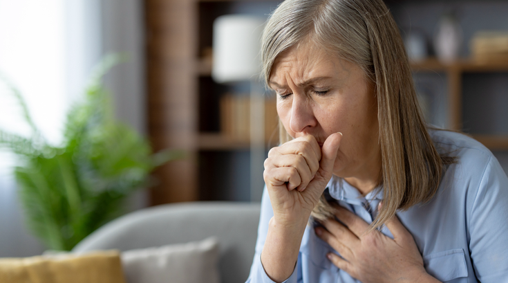 Purchased -  woman coughing, feeling unwell in living room