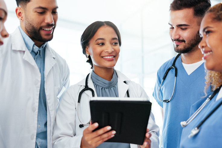 Purchased - Health care workers discussing a patient