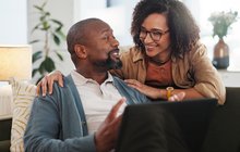 Purchased - Couple looking at plans on a computer