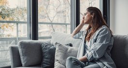 Purchased - Depressed person staring out a window