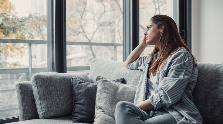 Purchased - Depressed person staring out a window