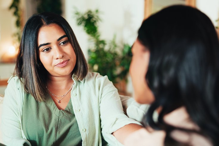 Friends with advice, talking and understanding in living room