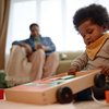 Purchased - Girl Playing with Building Blocks while Sitting on Carpet in Living Room