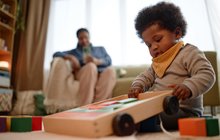 Purchased - Girl Playing with Building Blocks while Sitting on Carpet in Living Room