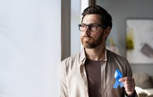 Purchased - Man holding blue ribbon supporting colon cancer awareness