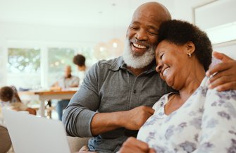 Purchased - Couple looking at plans on a computer