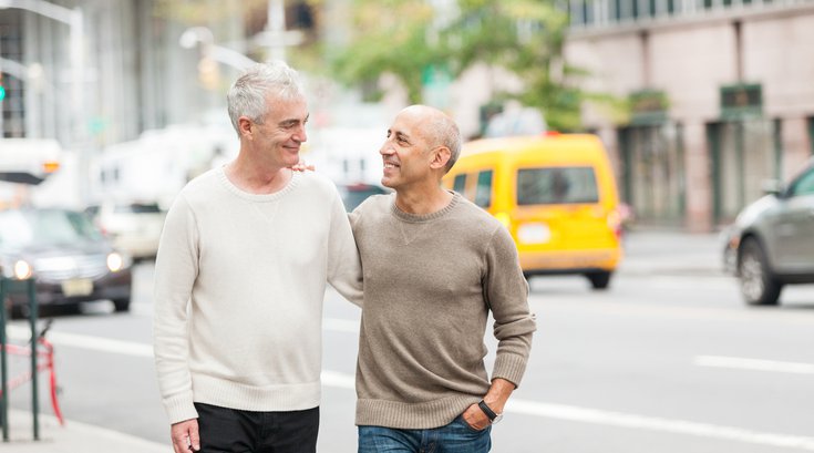 Purchased - Couple walking with each other in a city