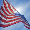 Purchased - American flag flying in the wind