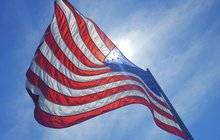 Purchased - American flag flying in the wind
