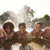 Limited = Kids Swimming in Pool Posing for a photo