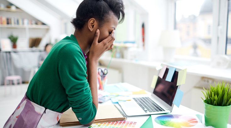 Fashion designer stressed at work