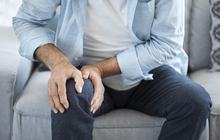 Purchased - man suffering from knee pain