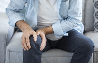 Purchased - man suffering from knee pain
