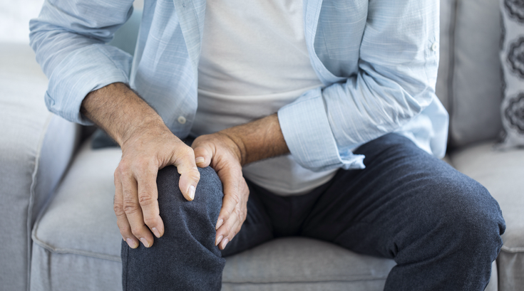 Purchased - man suffering from knee pain