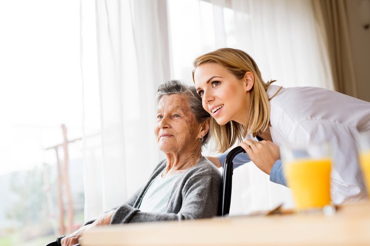 Woman with nurse in assisted living