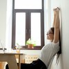 Woman stretching at work