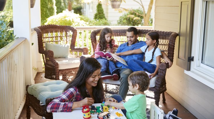 Family hanging out on porch