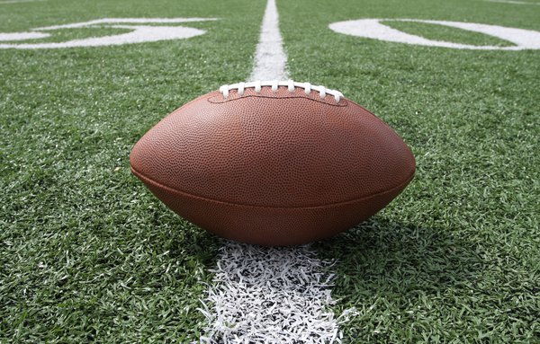 Purchased - Football sitting on field