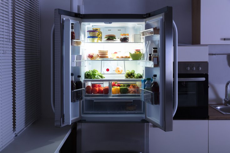 Open Refrigerator In Kitchen stock photo