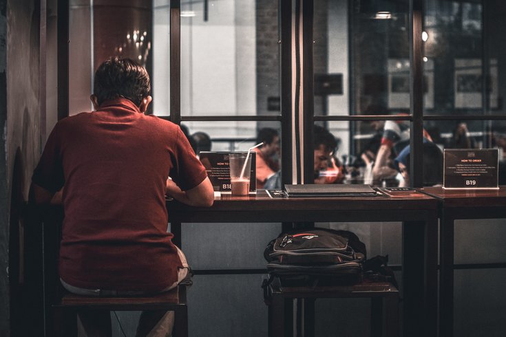 Person eating alone in a restaurant