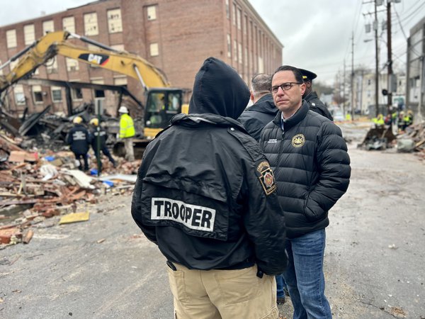 Governor Shapiro with first responders at West Reading factory explosion site.