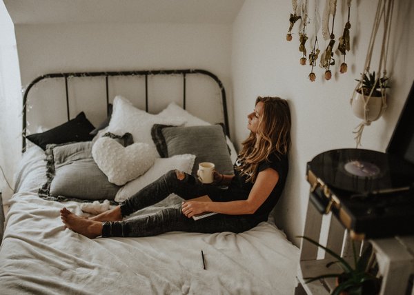 Depressed women sitting in bed