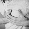 Man holding his chest in pain