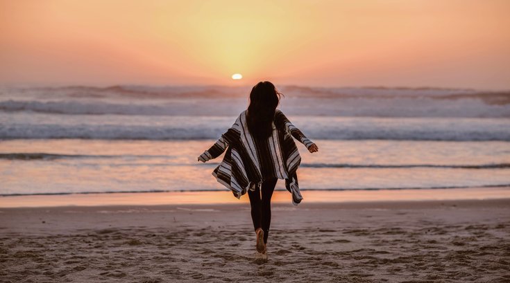 Woman running on a beach