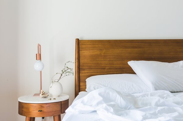Bed and nightstand with lamp