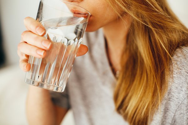 Woman drinking water from glass