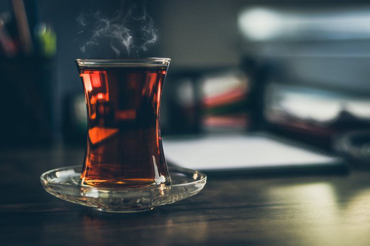 Black tea steaming on table