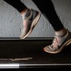 Woman running on treadmill with sneakers