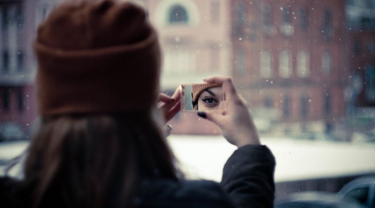 Person holding mirror