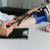 A blood pressure reading by clinician