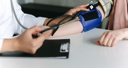 A blood pressure reading by clinician