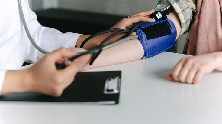 A blood pressure reading by clinician