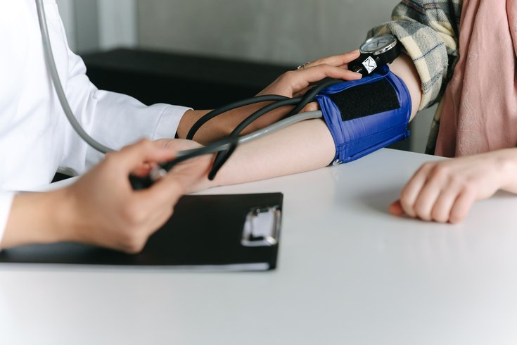 A blood pressure reading by clinician