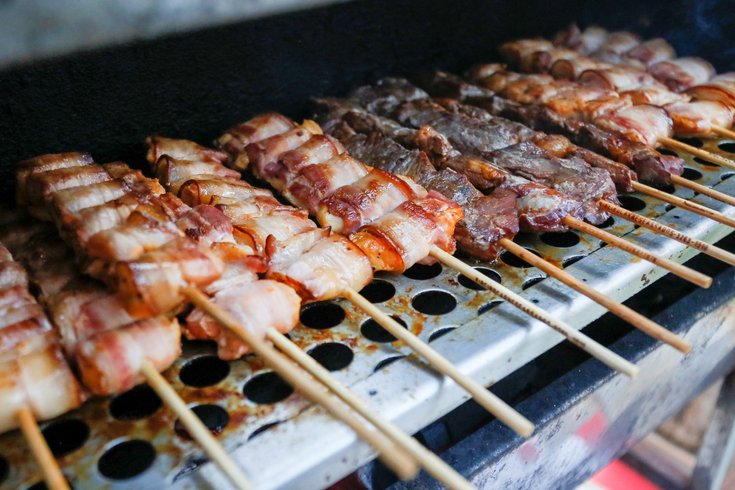 Bacon being cooked on a grill