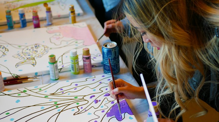 Woman in an art club painting